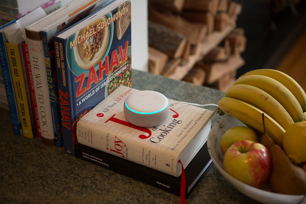 An Echo dot on the kitchen counter