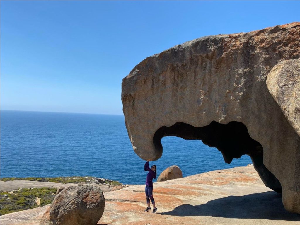 Vacation photo of a woman under a cliff overhang to display on an Amazon Echo Show