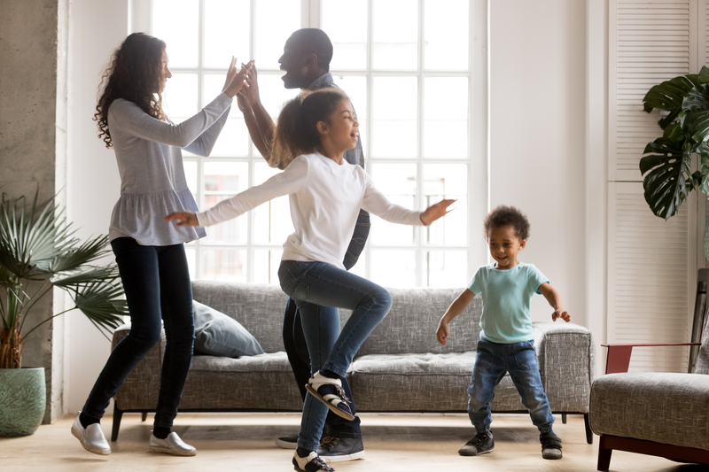 Family dancing to Alexa music playlist